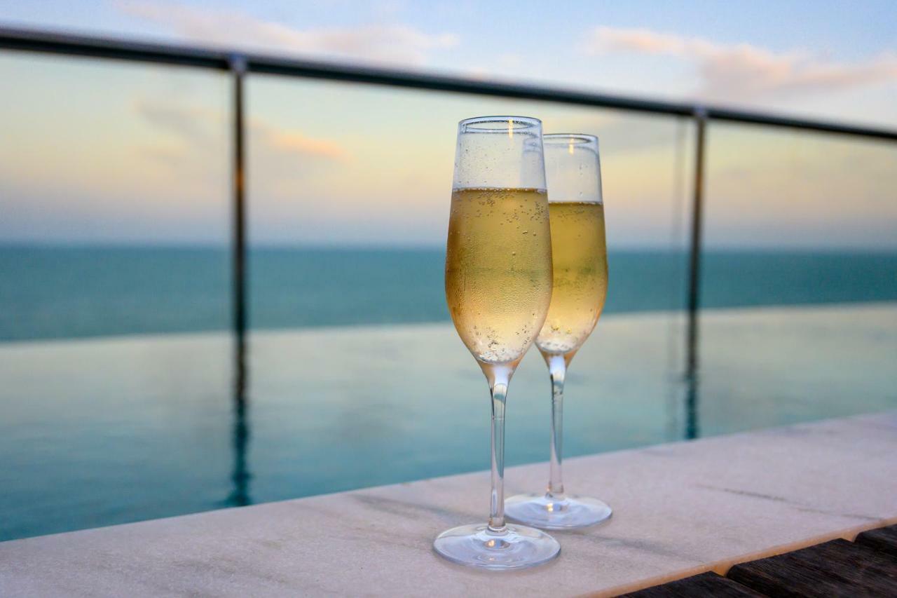 Vogal Luxury Beach Hotel & Spa Natal Exterior photo Two champagne flutes